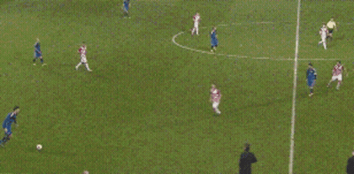 A Group Of Soccer Players Are Playing A Game On A Soccer Field GIF
