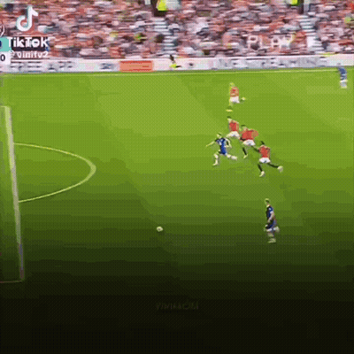 A Group Of Soccer Players Are Playing A Game On A Soccer Field . GIF