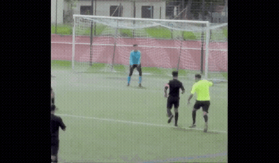 A Group Of Soccer Players Are Playing On A Field And One Of Them Is Wearing A Blue Jersey GIF