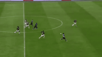 A Group Of Soccer Players Are Playing On A Field And One Player Has The Number 15 On His Jersey GIF