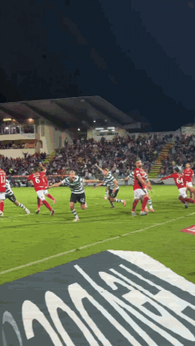 A Group Of Soccer Players Are Playing On A Field With A Banner In The Foreground That Says ' Allianz ' GIF