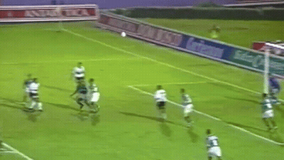 A Group Of Soccer Players Are Playing On A Field With A Banner That Says Antarctica GIF
