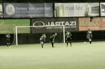 A Group Of Soccer Players Are Playing On A Field With A Banner That Says Maldex In The Background GIF