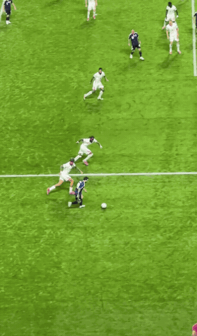A Group Of Soccer Players Are Playing On A Field With A Goal In The Background GIF