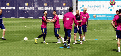 A Group Of Soccer Players Are Playing On A Field With A Nike Banner In The Background GIF
