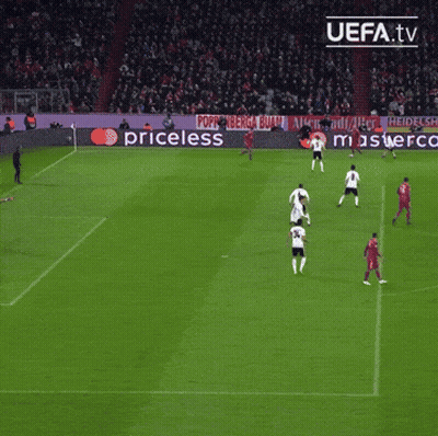 A Group Of Soccer Players Are Playing On A Field With A Ps4 Ad In The Background GIF