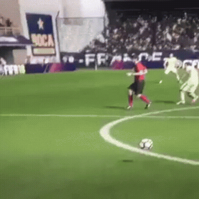 A Group Of Soccer Players Are Playing On A Field With A Sign That Says Boca On It GIF
