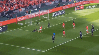 A Group Of Soccer Players Are Playing On A Field With Advertisements For Emirates GIF