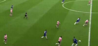 A Group Of Soccer Players Are Playing On A Field With The Words " Through Ball " Written On The Bottom . GIF
