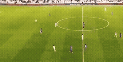 A Group Of Soccer Players Are Playing Soccer On A Field . GIF