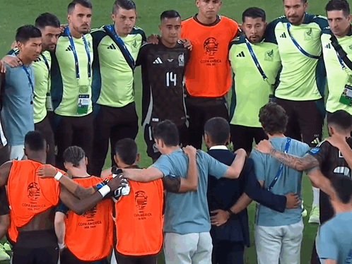 A Group Of Soccer Players Are Posing For A Photo And One Of Them Is Wearing Number 14 GIF