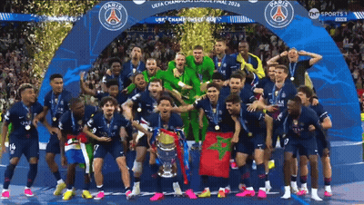 A Group Of Soccer Players Are Posing For A Photo With A Trophy That Says Paris GIF