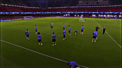 A Group Of Soccer Players Are Practicing On A Field With A Sign That Says ' Allianz ' On It GIF