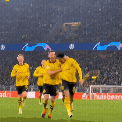 A Group Of Soccer Players Are Running On A Field In Front Of A Banner That Says ' Huisbet ' GIF