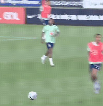 A Group Of Soccer Players Are Running On A Field In Front Of A Tcl Advertisement GIF