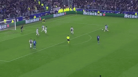A Group Of Soccer Players Are Running On A Field . One Of The Players Is Wearing A Fly Emirates Jersey . GIF