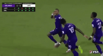 A Group Of Soccer Players Are Running On A Field With The Number 18 On Their Jersey GIF
