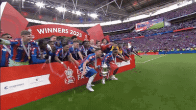 A Group Of Soccer Players Are Standing In Front Of A Sign That Says " Winners 2025 " GIF