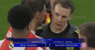 A Group Of Soccer Players Are Standing On A Field And One Of Them Is Wearing A Shirt With The Letter T On It GIF