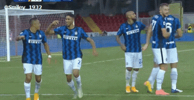A Group Of Soccer Players Are Standing On A Field Wearing Jerseys That Say Irelli GIF