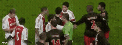 A Group Of Soccer Players Are Standing On A Field With One Wearing A Number 14 Jersey GIF
