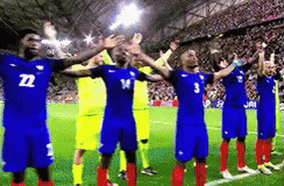 A Group Of Soccer Players Are Standing On A Field With Their Arms Outstretched And One Has The Number 3 On His Shirt GIF