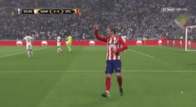 A Group Of Soccer Players Are Standing On A Field . GIF