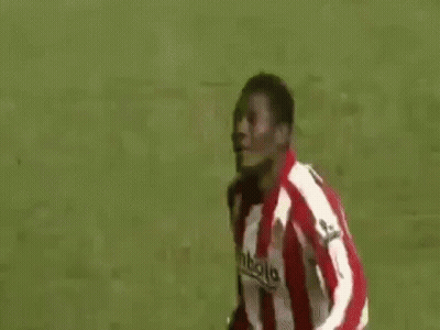 A Group Of Soccer Players Are Standing On Top Of A Soccer Field . GIF