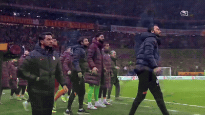A Group Of Soccer Players Are Walking On A Field With A Banner That Says ' Istanbul ' On It GIF