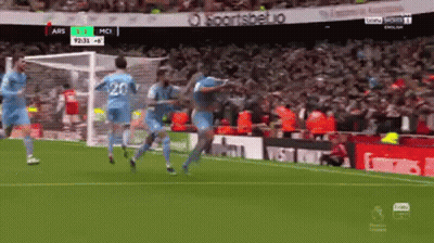 A Group Of Soccer Players Celebrate A Goal On A Field GIF