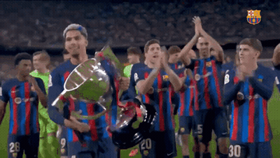 A Group Of Soccer Players Holding A Trophy With The Number 30 On The Back GIF