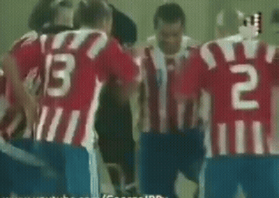 A Group Of Soccer Players Huddled Together With The Number 13 On Their Backs GIF