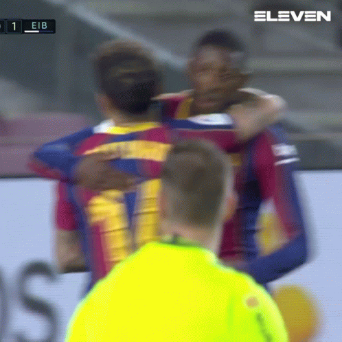 A Group Of Soccer Players Hugging Each Other With The Number 11 On The Back GIF