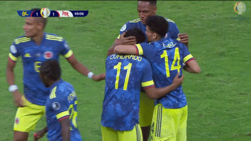 A Group Of Soccer Players Hugging One Another With The Number 11 On The Back GIF