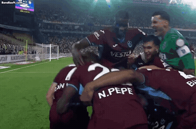 A Group Of Soccer Players Including N.pepe Are Huddled Together On A Field GIF