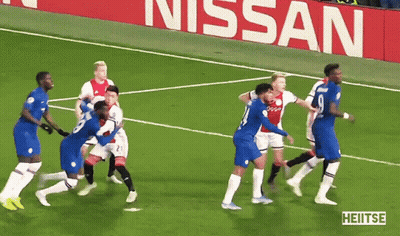 A Group Of Soccer Players On A Field In Front Of A Nissan Sign GIF