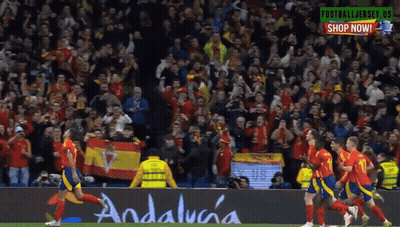 A Group Of Soccer Players On A Field With A Banner That Says Andalucia GIF