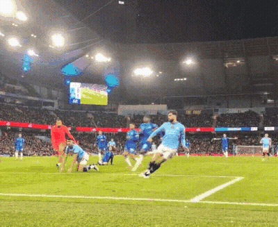 A Group Of Soccer Players On A Field With A Large Screen In The Background That Says ' Allianz ' On It GIF