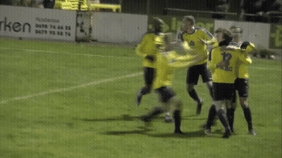 A Group Of Soccer Players On A Field With A Sign That Says Guy Van GIF