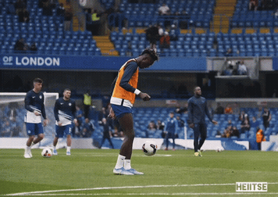 A Group Of Soccer Players On A Field With A Sign That Says London GIF