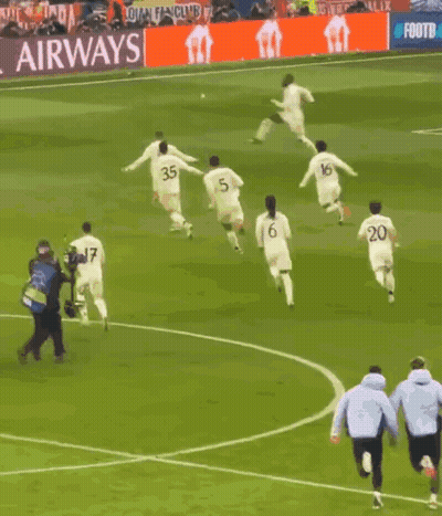 A Group Of Soccer Players On A Field With A Sign That Says That #Uclfeeling GIF