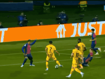 A Group Of Soccer Players On A Field With An Orange Sign That Says Just In The Background GIF