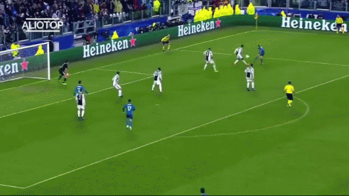 A Group Of Soccer Players On A Field With Heineken Ads GIF