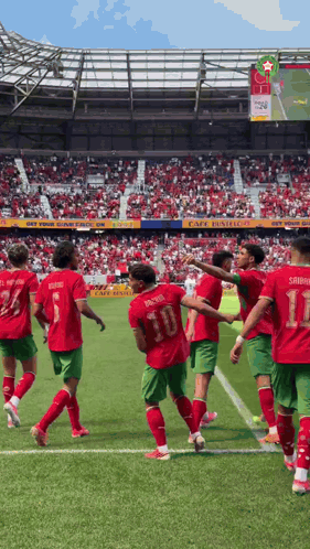A Group Of Soccer Players On A Field With One Wearing Number 10 GIF