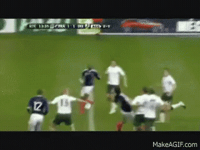 A Group Of Soccer Players On A Field With One Wearing Number 12 GIF