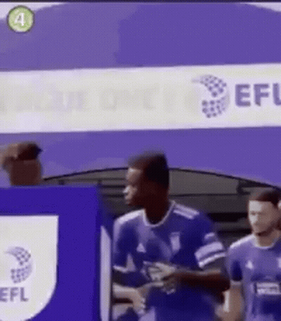 A Group Of Soccer Players Standing In Front Of A Sign That Says Efl . GIF