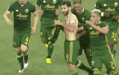 A Group Of Soccer Players Wearing Alaska Airlines Jerseys Are Running On The Field GIF