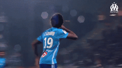 A Group Of Soccer Players Wearing Blue Jerseys With The Number 19 On Them GIF
