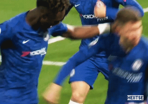 A Group Of Soccer Players Wearing Blue Jerseys With Yokohama Tyres Written On Them GIF