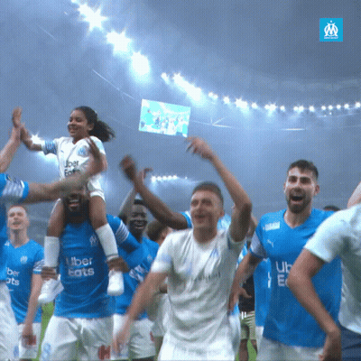 A Group Of Soccer Players Wearing Blue Uber Eats Jerseys GIF